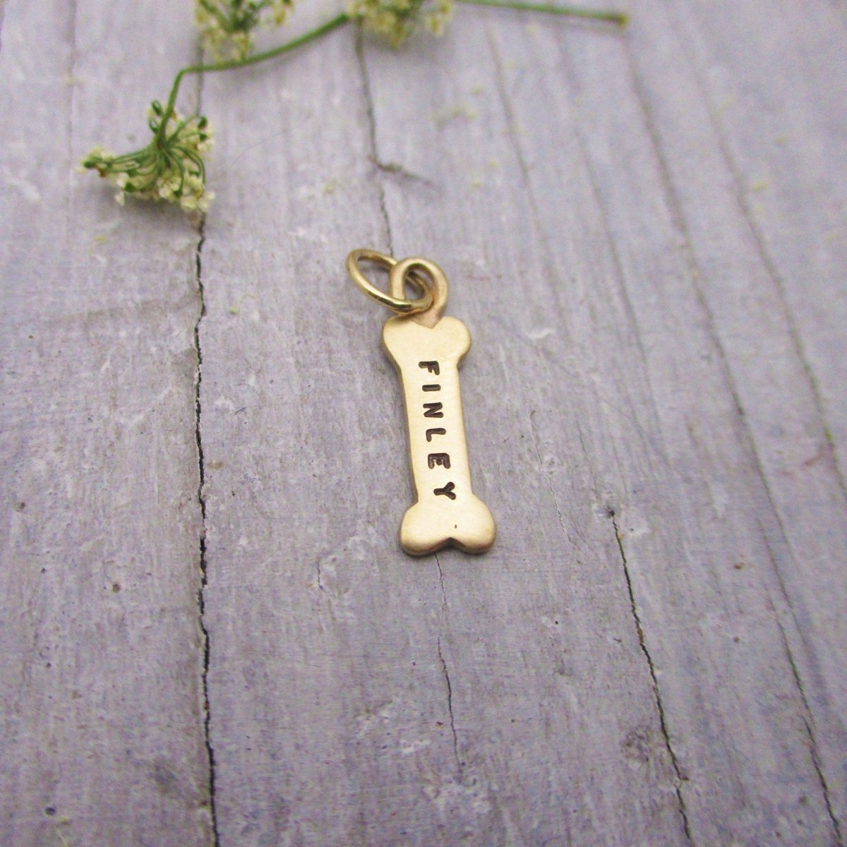 Gold dog bone charm hotsell